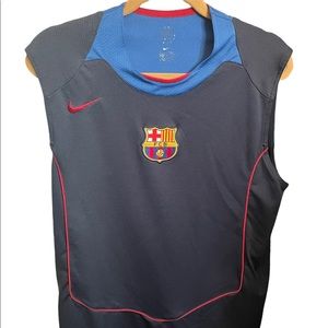 Nike sleeveless Barcelona FC shirt.